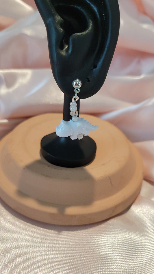White Dinosaur Dangle Earrings by When The Sun Doth Sleep